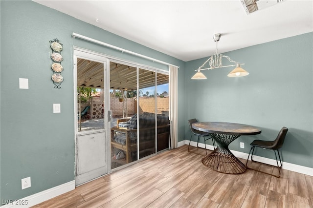 8505 Lansdale Rd, Las Vegas, NV 89123 - dining area featuring wood finished floors and baseboards