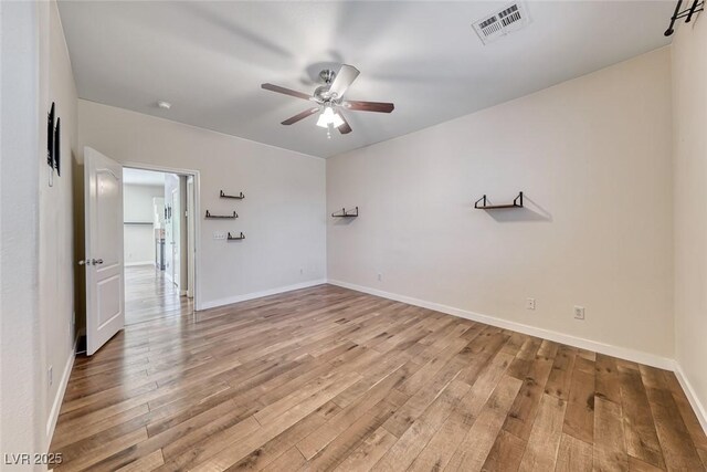 4044 Villeroy Ave, Las Vegas, NV 89141 - unfurnished room featuring a ceiling fan, light wood finished floors, and baseboards