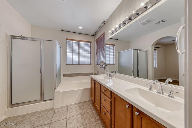 4044 Villeroy Ave, Las Vegas, NV 89141 - bathroom with a shower stall, a garden tub, double vanity, and tile patterned flooring