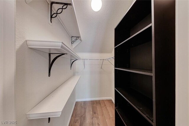 4044 Villeroy Ave, Las Vegas, NV 89141 - spacious closet with light wood-style floors