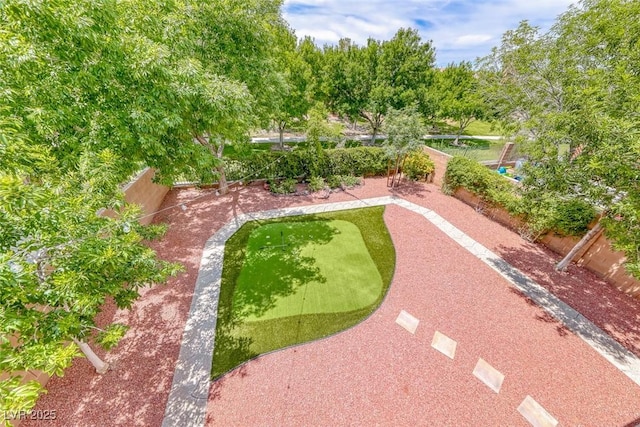 4044 Villeroy Ave, Las Vegas, NV 89141 - fenced backyard with an area to practice putting
