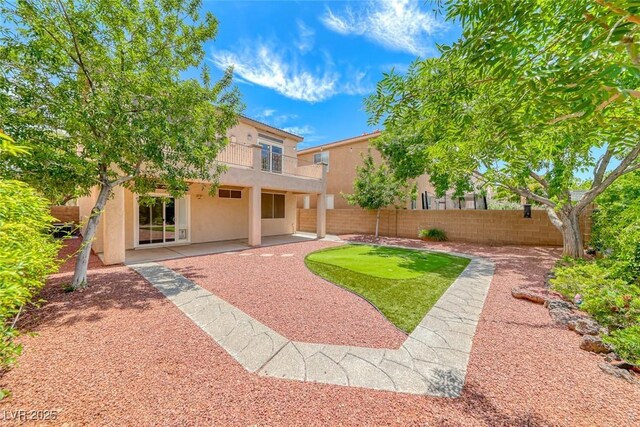 4044 Villeroy Ave, Las Vegas, NV 89141 - rear view of house featuring stucco siding and a patio area