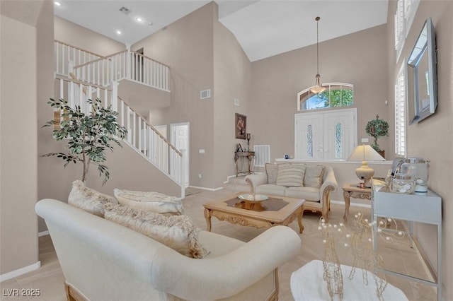 9017 Cotton Rose Way, Las Vegas, NV 89134 - living area featuring stairway, high vaulted ceiling, and baseboards