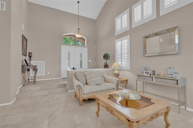 9017 Cotton Rose Way, Las Vegas, NV 89134 - living room featuring high vaulted ceiling and baseboards