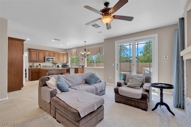 9017 Cotton Rose Way, Las Vegas, NV 89134 - living room with a chandelier, baseboards, ceiling fan, recessed lighting, and light tile patterned flooring