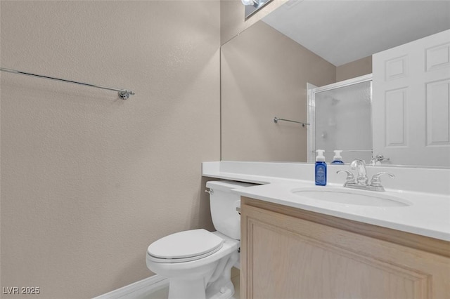 9017 Cotton Rose Way, Las Vegas, NV 89134 - full bathroom featuring vanity, toilet, baseboards, and a shower with door