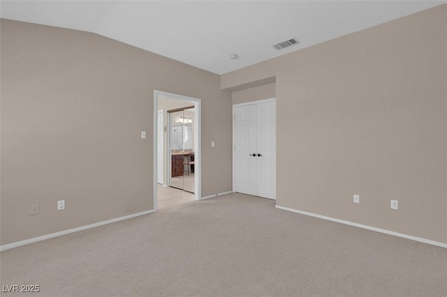 9017 Cotton Rose Way, Las Vegas, NV 89134 - unfurnished room featuring light colored carpet, baseboards, and vaulted ceiling