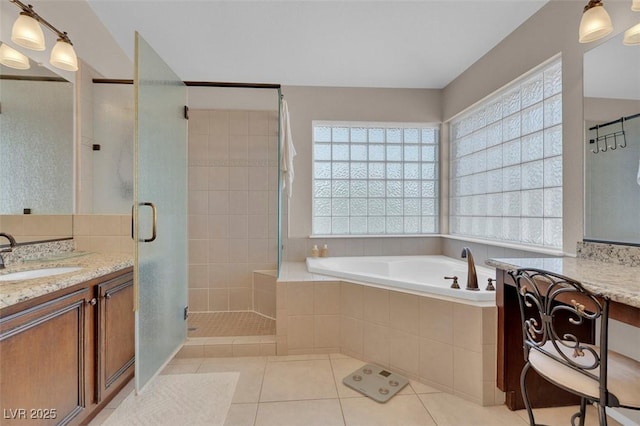 9017 Cotton Rose Way, Las Vegas, NV 89134 - bathroom featuring vanity, plenty of natural light, a stall shower, and tile patterned floors