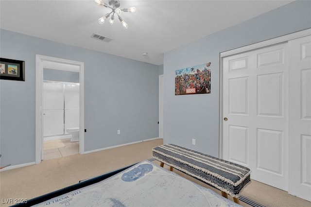 9017 Cotton Rose Way, Las Vegas, NV 89134 - carpeted bedroom featuring baseboards, a closet, connected bathroom, and a chandelier