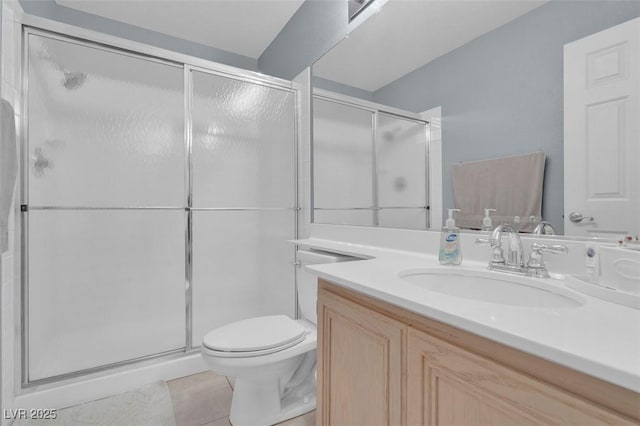 9017 Cotton Rose Way, Las Vegas, NV 89134 - bathroom with vanity, a shower stall, tile patterned flooring, and toilet