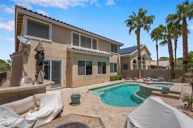 9017 Cotton Rose Way, Las Vegas, NV 89134 - back of property featuring stucco siding, a patio area, a fenced backyard, area for grilling, and a tiled roof