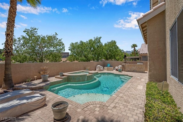 9017 Cotton Rose Way, Las Vegas, NV 89134 - view of swimming pool with a patio, a fenced backyard, and a pool with connected hot tub