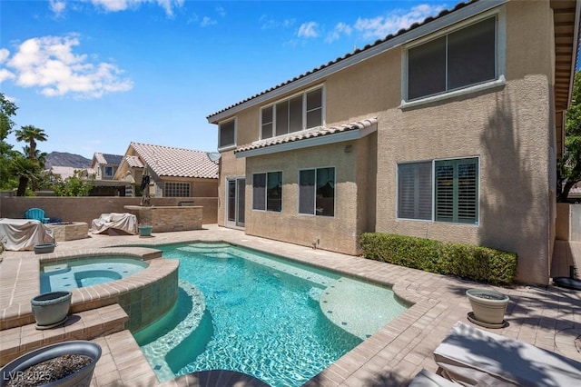 9017 Cotton Rose Way, Las Vegas, NV 89134 - view of swimming pool with a patio, a pool with connected hot tub, an outdoor kitchen, and an outdoor fire pit