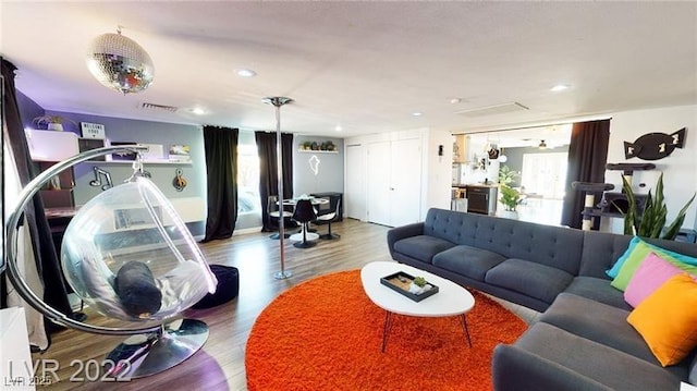 5817 Rae Dr, Las Vegas, NV 89108 - living room featuring wood finished floors and recessed lighting
