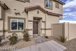 7915 Pandora Sky St Unit 402, North Las Vegas, NV 89084 - view of exterior entry featuring stucco siding