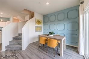 7915 Pandora Sky St Unit 402, North Las Vegas, NV 89084 - dining space featuring wood finished floors and stairway