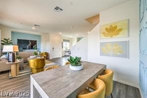 7915 Pandora Sky St Unit 402, North Las Vegas, NV 89084 - dining area featuring wood finished floors, baseboards, and recessed lighting