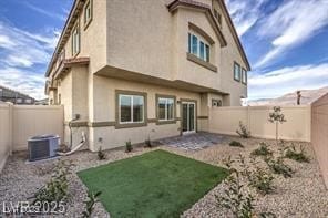 7915 Pandora Sky St Unit 402, North Las Vegas, NV 89084 - rear view of house featuring central AC and stucco siding