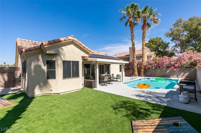 8150 Beaverbrook Way, Las Vegas, NV 89123 - rear view of property with solar panels, a patio, stucco siding, and a tile roof