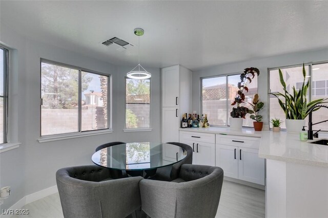 8150 Beaverbrook Way, Las Vegas, NV 89123 - dining area featuring light wood-type flooring and baseboards