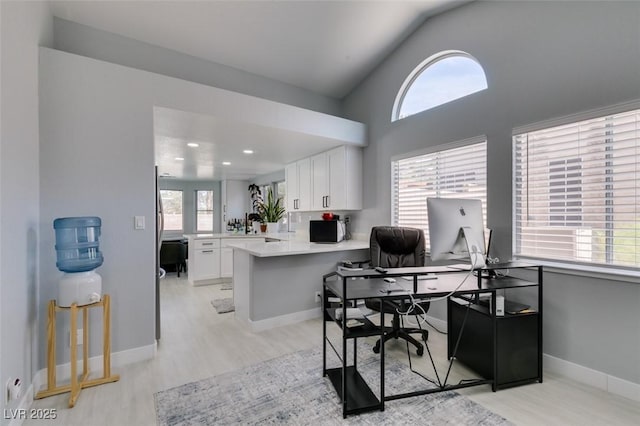 8150 Beaverbrook Way, Las Vegas, NV 89123 - office with light wood-type flooring, vaulted ceiling, and baseboards