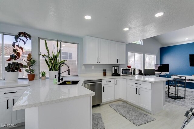 8150 Beaverbrook Way, Las Vegas, NV 89123 - kitchen featuring stainless steel appliances, a peninsula, a sink, recessed lighting, and white cabinets