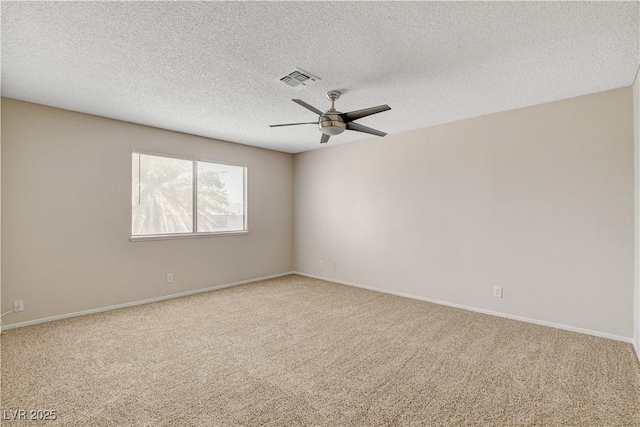 7004 Powderhorn Cir, Las Vegas, NV 89128 - spare room featuring carpet, ceiling fan, baseboards, and a textured ceiling