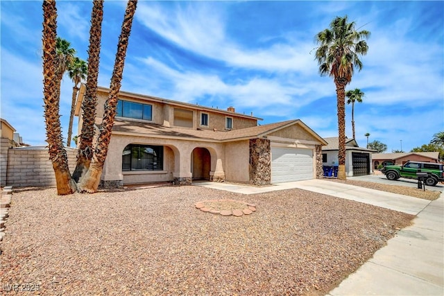 7004 Powderhorn Cir, Las Vegas, NV 89128 - view of front of house with stucco siding, a garage, concrete driveway, and stone siding