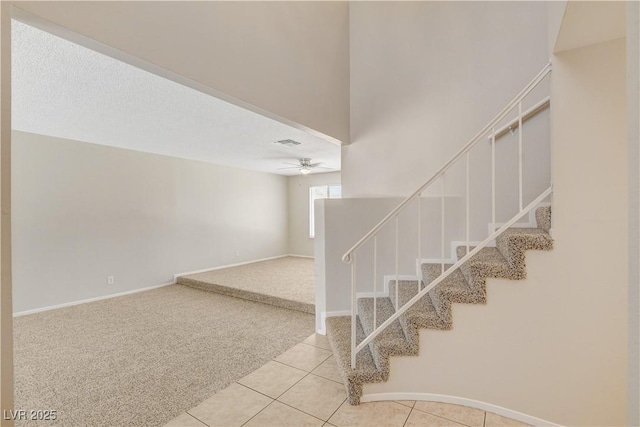 7004 Powderhorn Cir, Las Vegas, NV 89128 - staircase with ceiling fan, carpet flooring, tile patterned floors, and baseboards