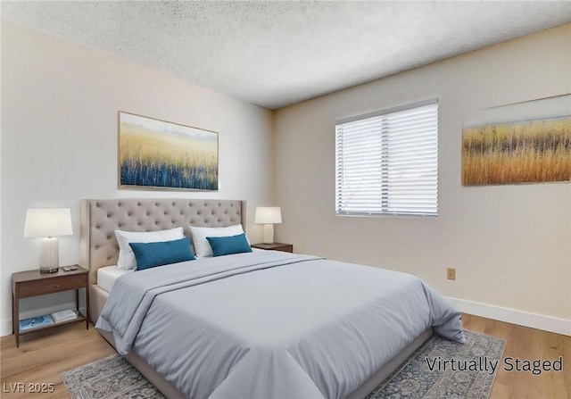 8233 Willeta Ave, Las Vegas, NV 89145 - bedroom with baseboards, wood finished floors, and a textured ceiling
