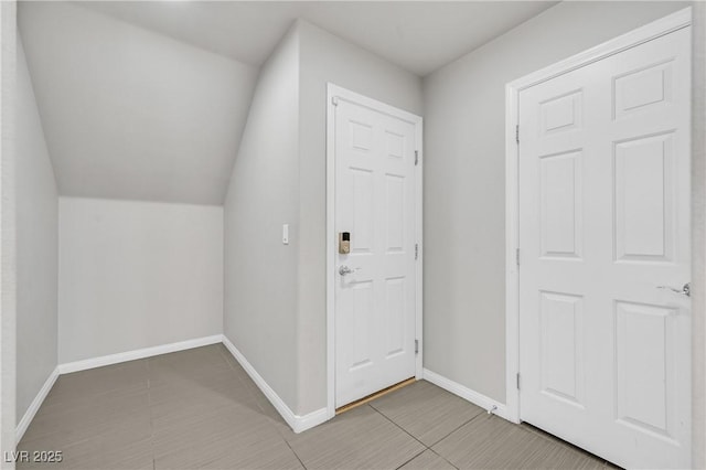 6507 Creekside Cellars Ct, Las Vegas, NV 89139 - bonus room with light tile patterned floors, baseboards, and lofted ceiling