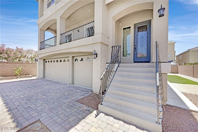 6507 Creekside Cellars Ct, Las Vegas, NV 89139 - view of front of property featuring stucco siding, decorative driveway, and an attached garage