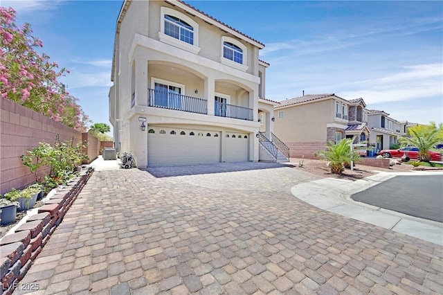 6507 Creekside Cellars Ct, Las Vegas, NV 89139 - view of front of house featuring stucco siding, decorative driveway, a garage, and central air condition unit