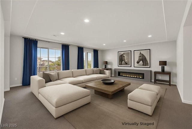 6507 Creekside Cellars Ct, Las Vegas, NV 89139 - carpeted living area featuring recessed lighting, baseboards, and a glass covered fireplace