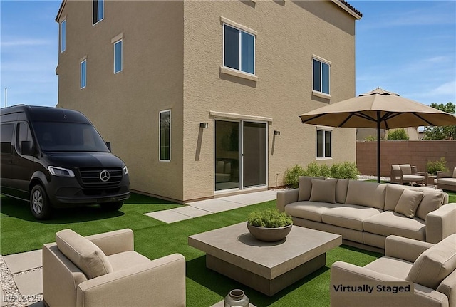 6507 Creekside Cellars Ct, Las Vegas, NV 89139 - rear view of house featuring outdoor lounge area, stucco siding, and a patio area