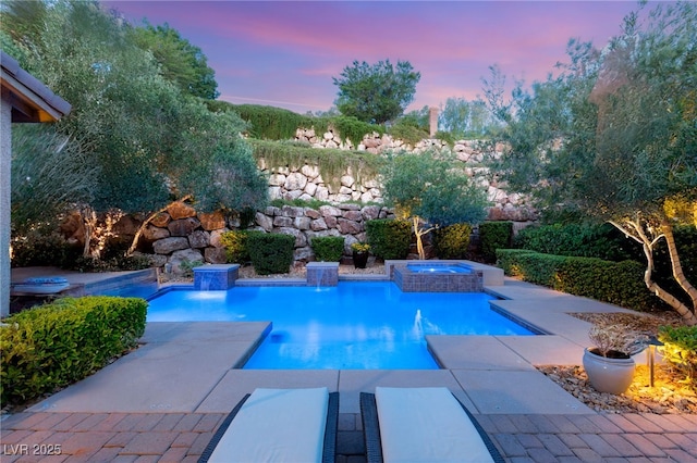 900 Cantura Mills Rd, Henderson, NV 89052 - pool at dusk with an in-ground hot tub, an outdoor pool, and a patio