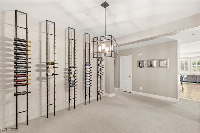 900 Cantura Mills Rd, Henderson, NV 89052 - wine room featuring carpet, a chandelier, and baseboards