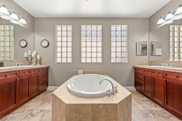 900 Cantura Mills Rd, Henderson, NV 89052 - full bathroom with two vanities, a bath, and tile patterned floors