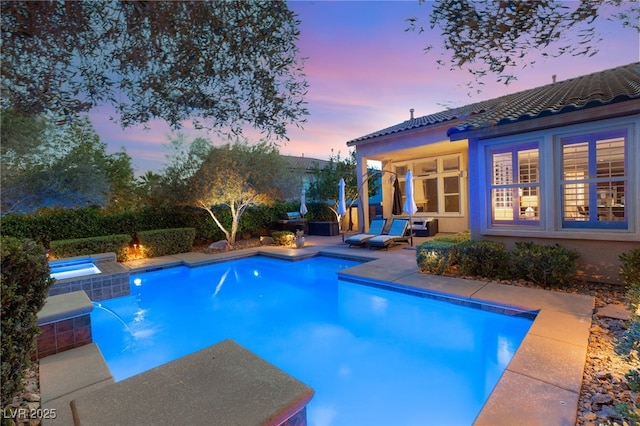 900 Cantura Mills Rd, Henderson, NV 89052 - pool at dusk with a patio and a pool with connected hot tub
