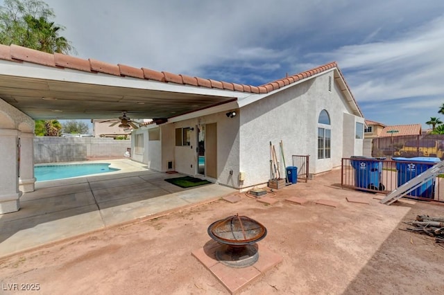 1523 Silver Point Ave, Las Vegas, NV 89123 - rear view of house featuring an outdoor fire pit, stucco siding, a fenced backyard, and ceiling fan