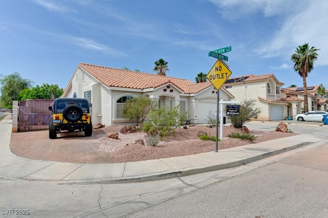1523 Silver Point Ave, Las Vegas, NV 89123 - mediterranean / spanish house featuring stucco siding, a tiled roof, and driveway