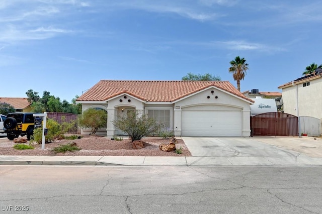 1523 Silver Point Ave, Las Vegas, NV 89123 - mediterranean / spanish house with a gate, a tiled roof, a garage, stucco siding, and concrete driveway