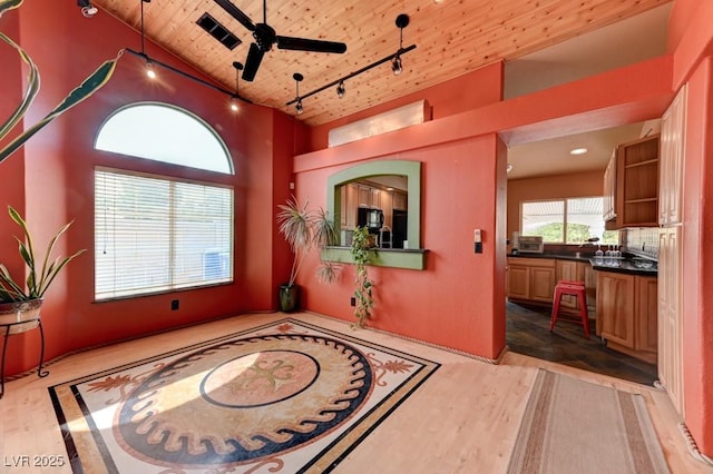1523 Silver Point Ave, Las Vegas, NV 89123 - interior space featuring wooden ceiling, rail lighting, a high ceiling, and light wood-style flooring