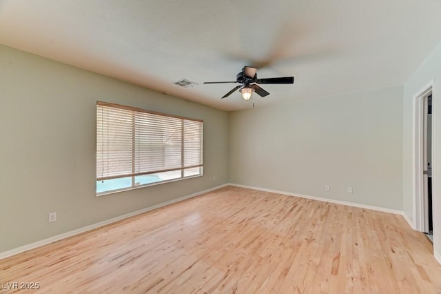 1523 Silver Point Ave, Las Vegas, NV 89123 - unfurnished room with ceiling fan, light wood-style floors, and baseboards