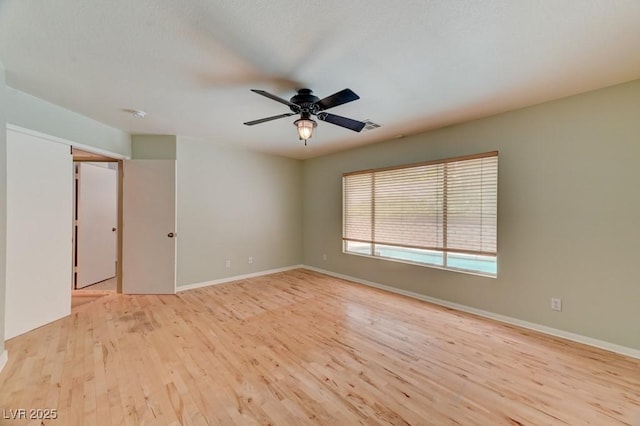 1523 Silver Point Ave, Las Vegas, NV 89123 - spare room featuring wood finished floors, a ceiling fan, and baseboards