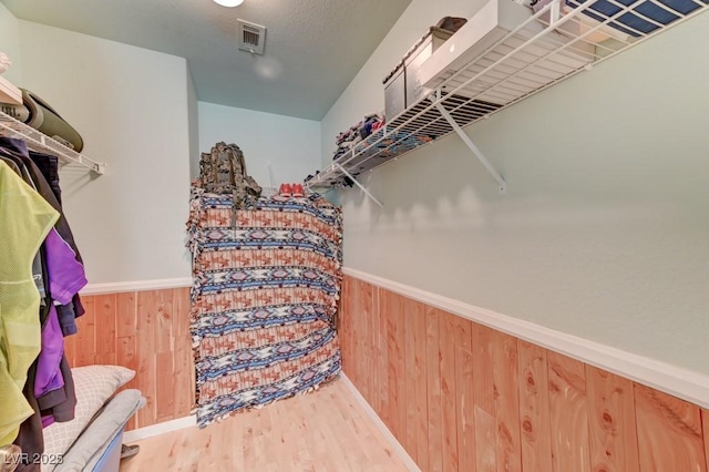 1523 Silver Point Ave, Las Vegas, NV 89123 - walk in closet featuring wood finished floors