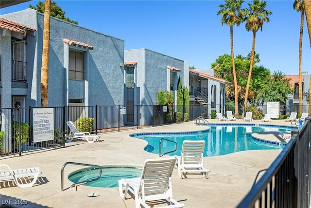 5191 Caliente St Unit 84, Las Vegas, NV 89119 - community pool featuring a hot tub and a patio