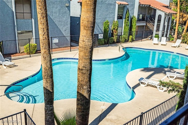 5191 Caliente St Unit 84, Las Vegas, NV 89119 - community pool featuring a patio area