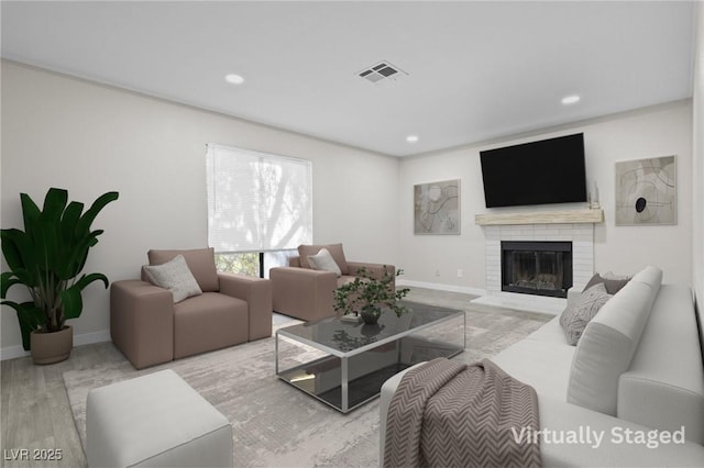 5191 Caliente St Unit 84, Las Vegas, NV 89119 - living room featuring a brick fireplace, recessed lighting, baseboards, and wood finished floors