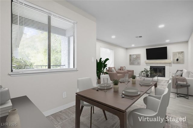 5191 Caliente St Unit 84, Las Vegas, NV 89119 - dining space with light wood finished floors, recessed lighting, a fireplace, and baseboards